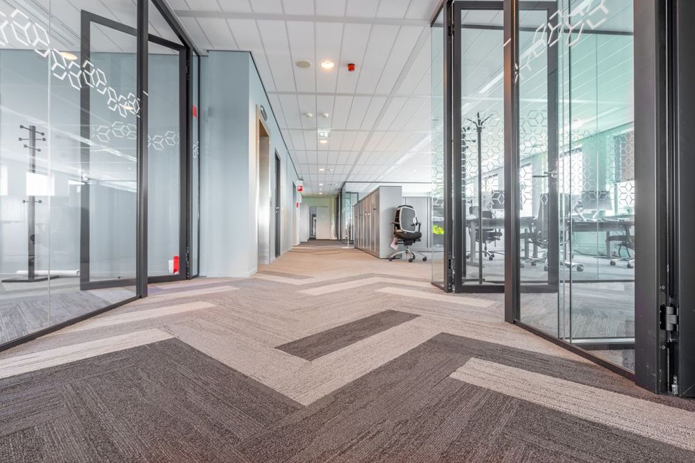 Modern office hallway with carpet cleaned for a Meriden, CT business